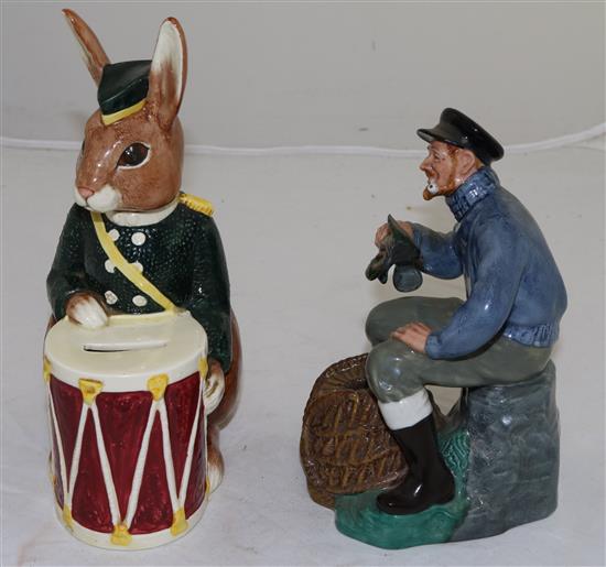 A Royal Doulton Bunnykins bank and a figure The Lobster Man